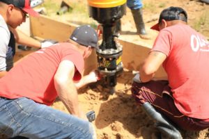 drilling helical piers at worksite